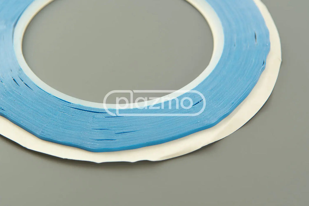 Blue 2mm double sided tape wound on a white core full 25m roll for versatile sided tape applications