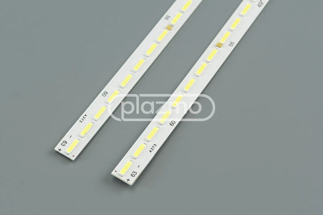 Two white led backlight strips with yellow rectangular leds and printed markings for lg 49 v16 art3 uhd signage