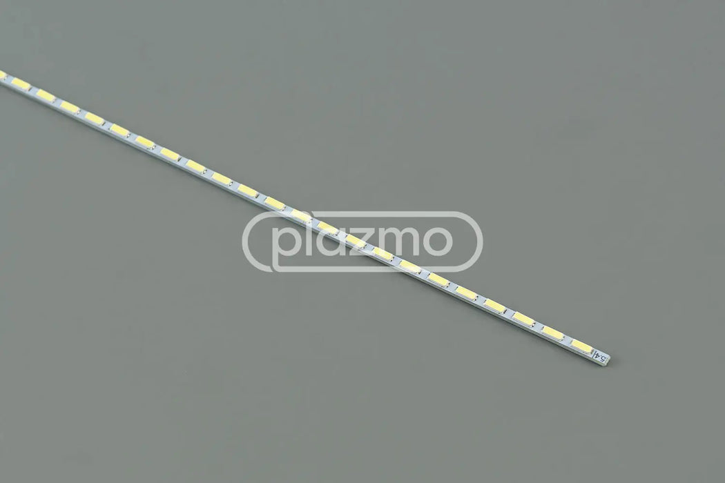 A sleek silver universal led strip with evenly spaced yellowish-white leds for led replacement in lcd panels