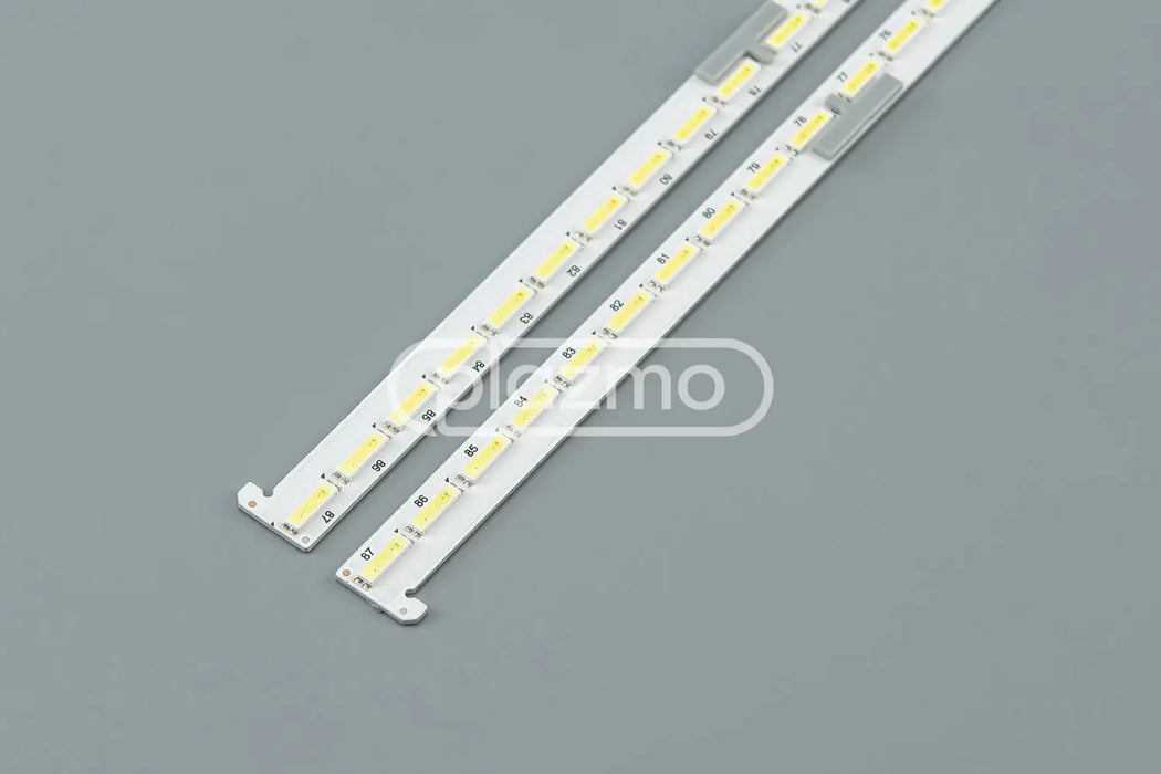 Two white led strips with yellowish led chips and gray mounting clips for 65-inch lg uh5f series bc-h e469119 94v-0 backlight replacements