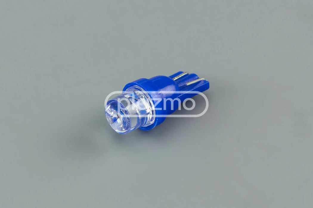 Blue led indicator lamp with concave head lens and three-pronged wedge base for 12 vdc use